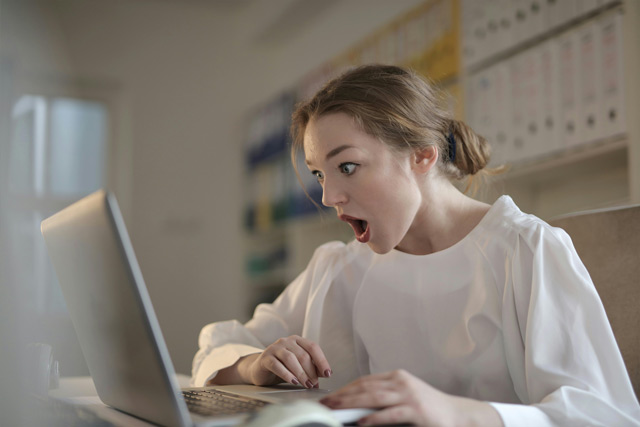 Overwhelmed influencer checking her income after first mont of cooperating with Pralax Marketing